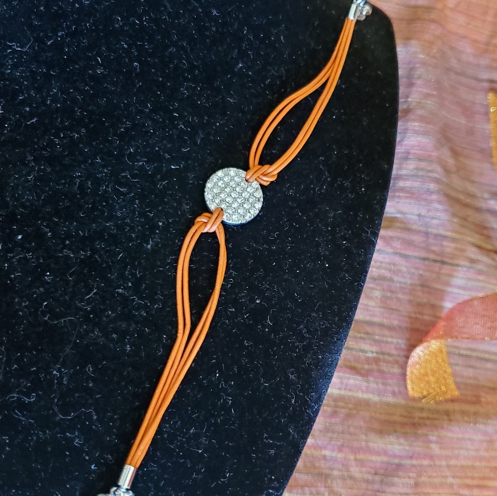 Lia Sophia silvertone pavé orange cord bracelet